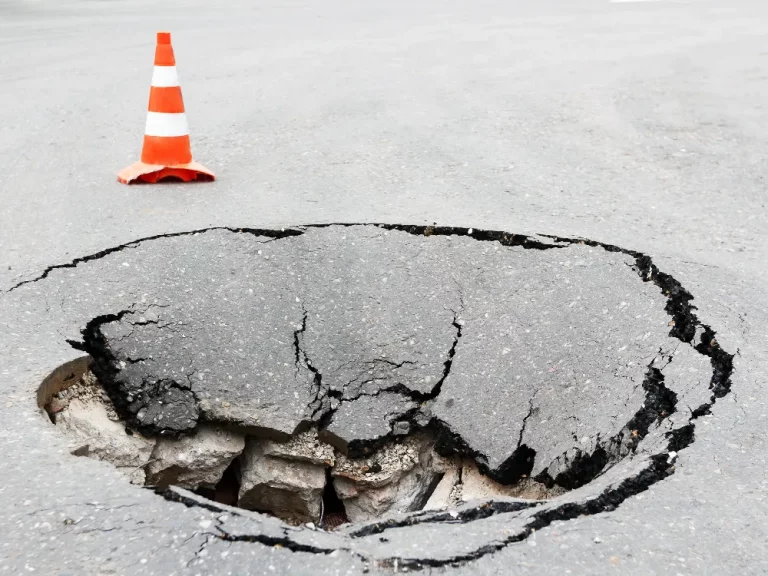 asphalt pothole repair. big deep pothole