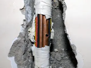 emergency pipe repair solutions. Bundle of pipes burst in DFW Texas